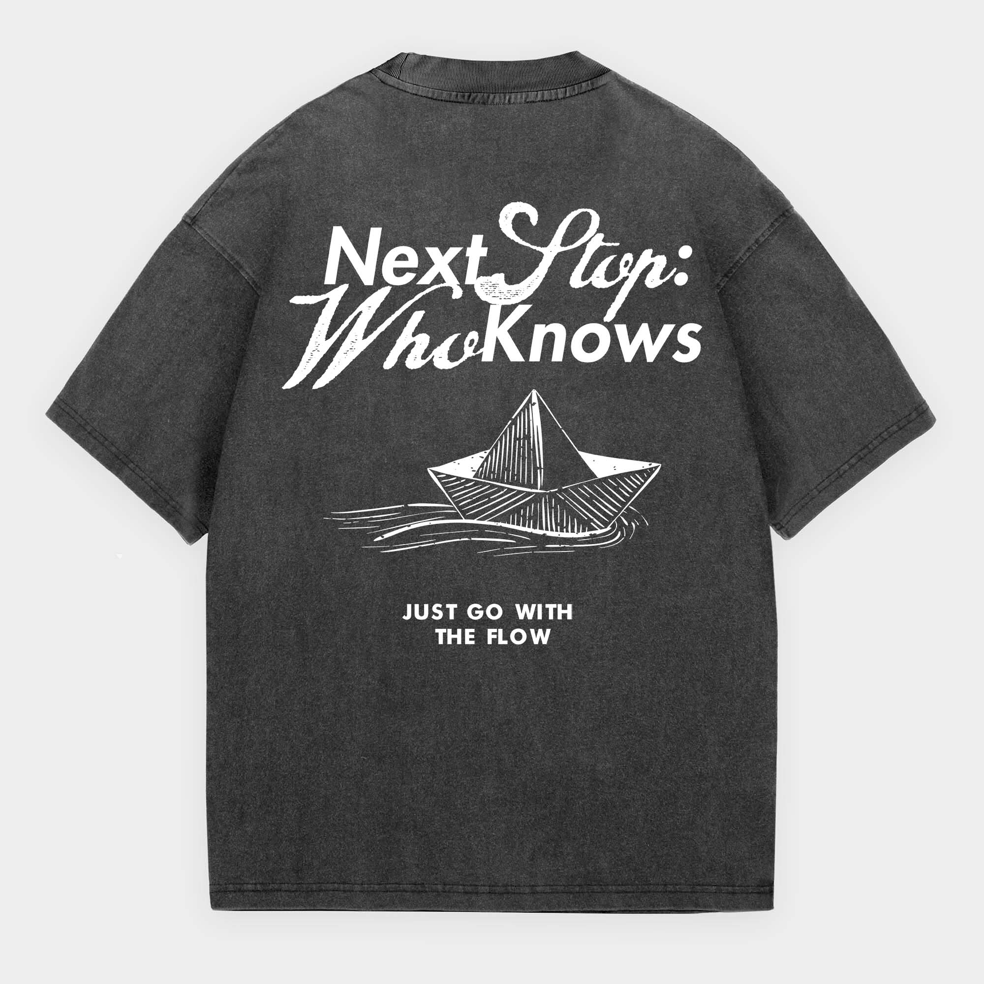 Black t-shirt with white text and graphic on a gray background with text Next Stop: Who Knows Just Go With The Flow
